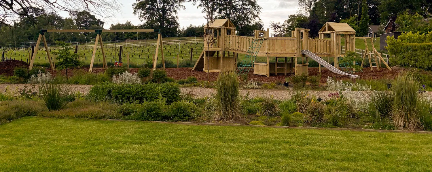 Hotel playground with play trails and swings
